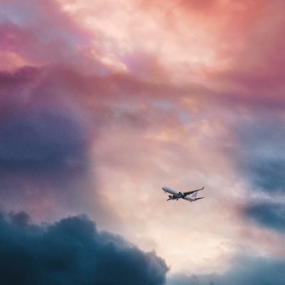 a plane flying during a sunet